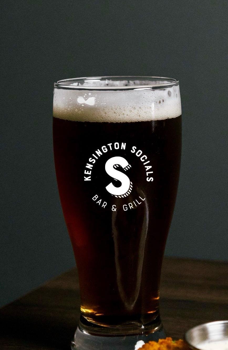 Ice cold draft beer on tap at Kensington Socials bar, Toronto